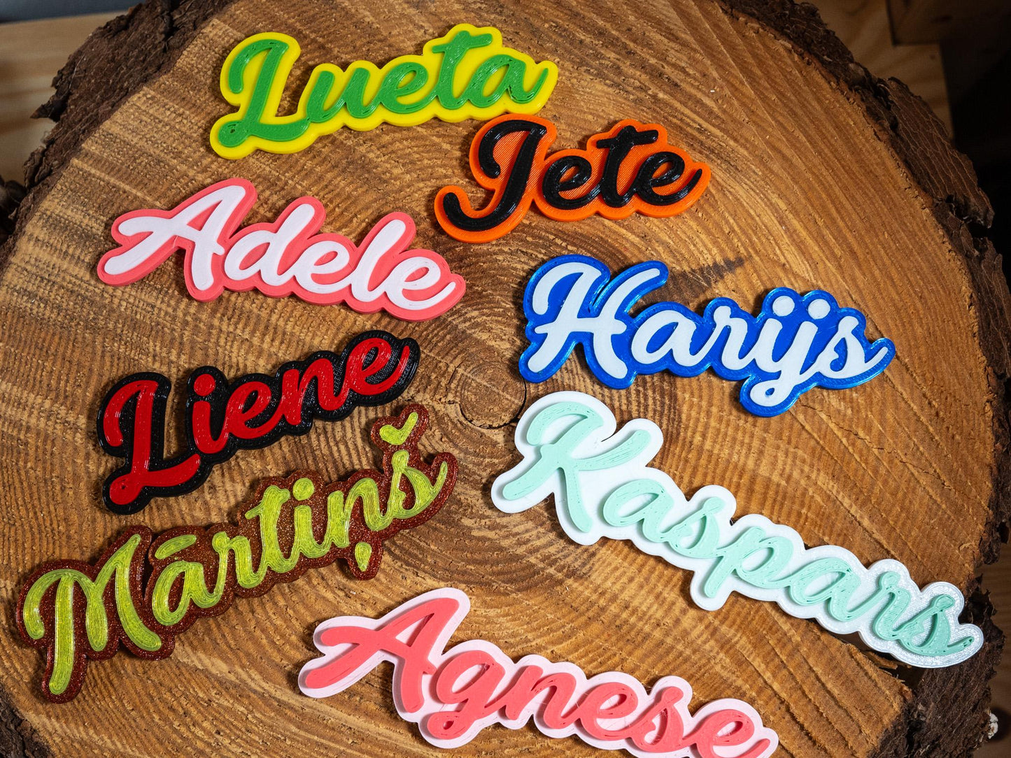 Colorful name patches on a wooden surface