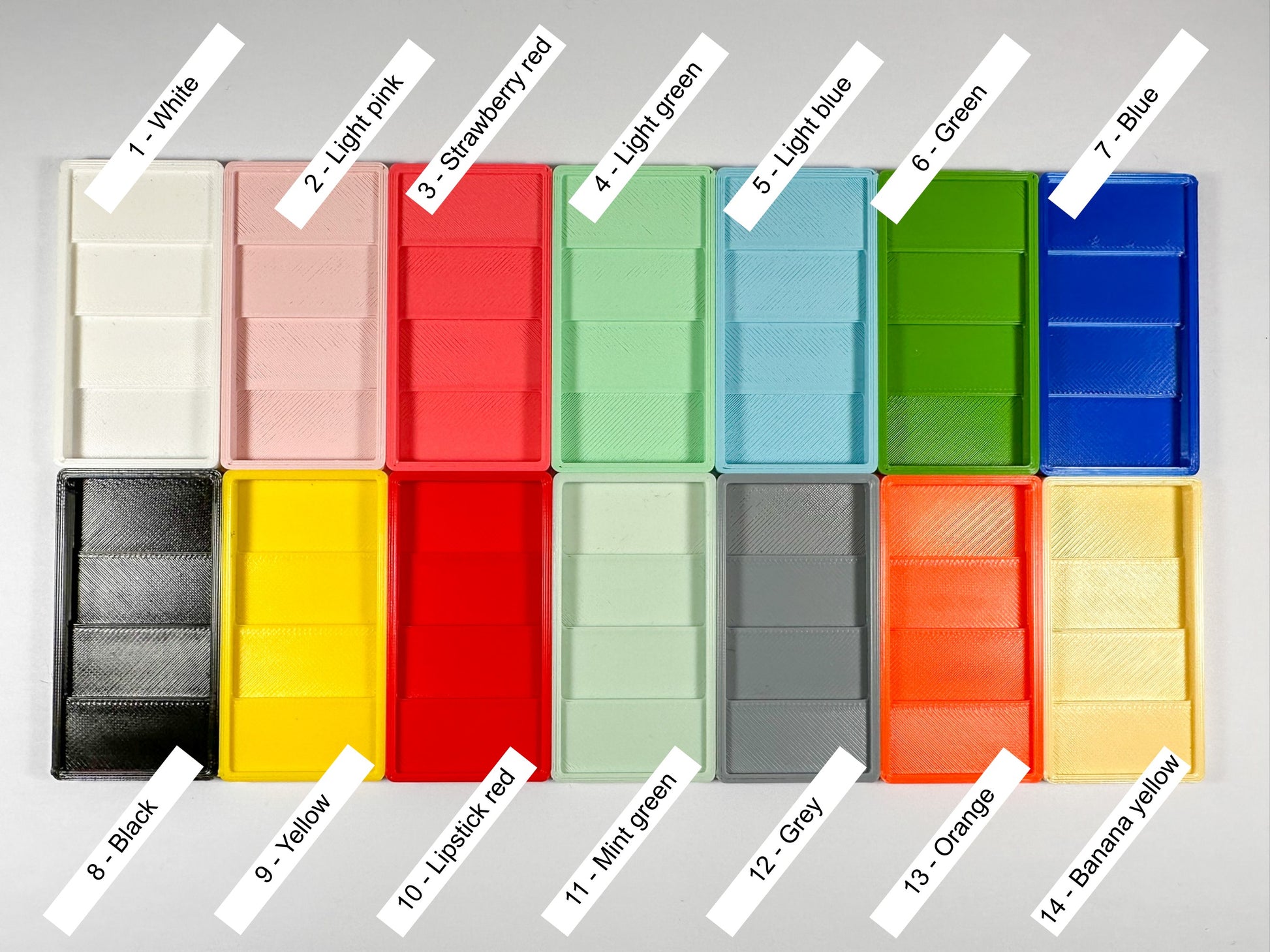 Set of colorful plastic bins with labels indicating their colors on a gray background.