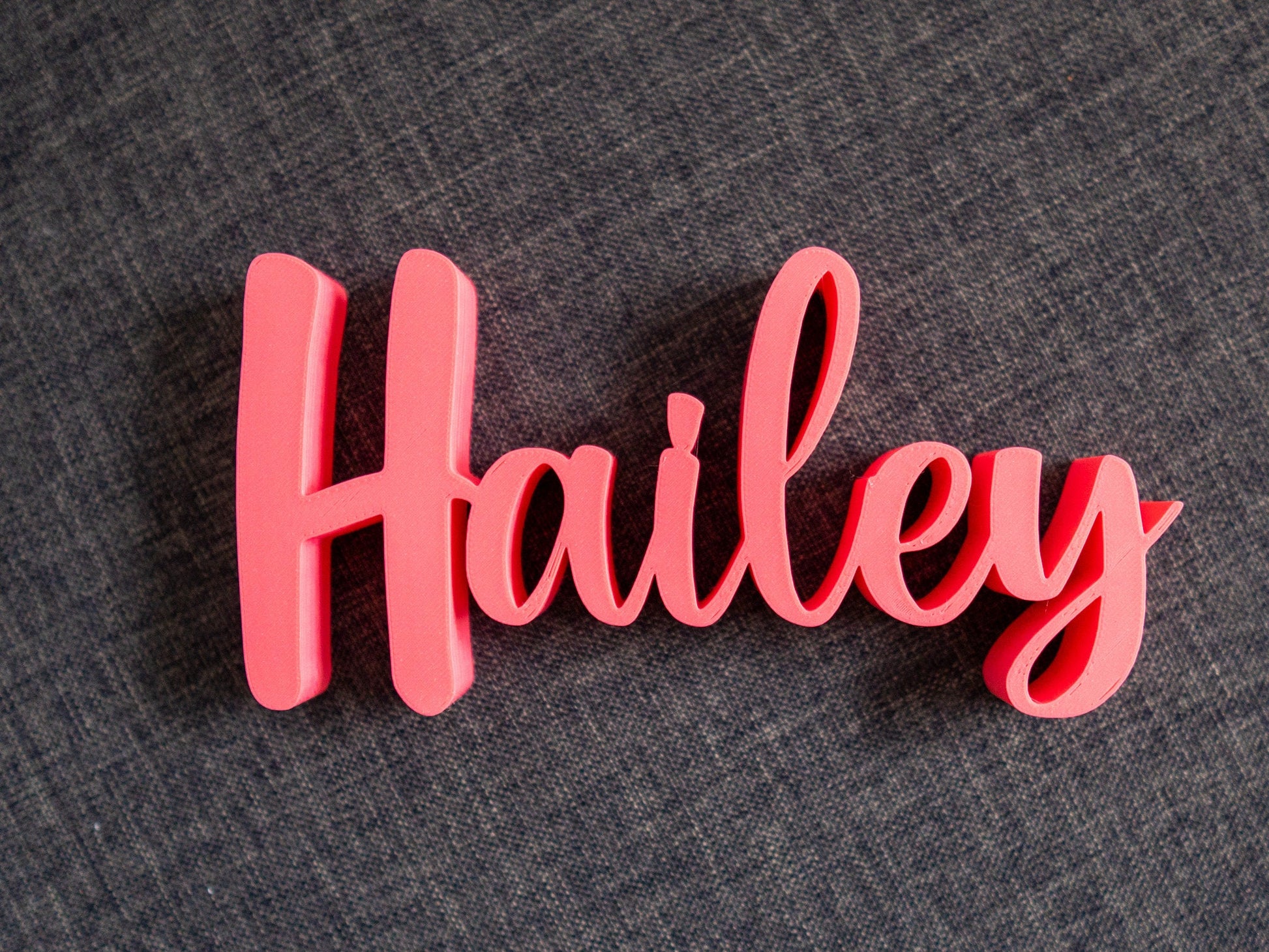 decorative name 'Hailey' on a gray  background