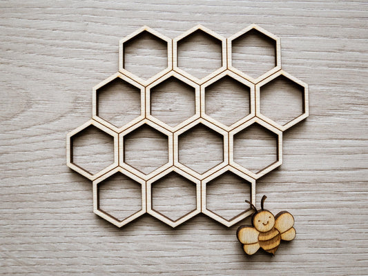 Wooden honeycomb design on a wooden surface with a small wooden bee.